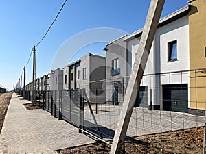 Exterior view of a modern townhouse. The concept of outdoor buildings of multi-apartment residential townhouses