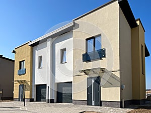 Exterior view of a modern townhouse. The concept of outdoor buildings of multi-apartment residential townhouses