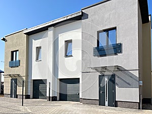 Exterior view of a modern townhouse. The concept of outdoor buildings of multi-apartment residential townhouses