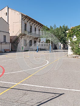 Exterior view of public school building with playground