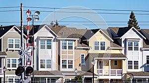 Exterior view of residential buildings built next to railroad tracks in Silicon Valley, Mountain View, South San Francisco bay