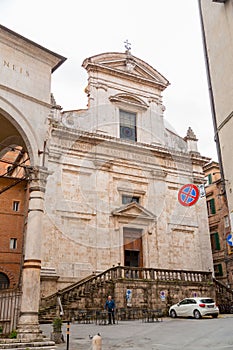 Exterior view of San Martino Church next to La Loggia in Siena, Tuscany, Italy