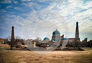 Exterior view to Mausoleum of Pahlavon Mahmoud, Juma mosque and Khoja minor minaret at Itchan Kala, Khiva, Uzbekistan