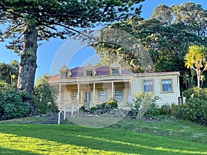 Exterior view of Vaughan Historic Homestead in a sunny day, Long Bay Regional Park, Auckland, New Zealand