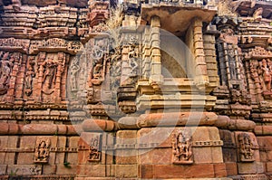 Exterior wall of temple ruins and beautifully carved stone sculpture of Hindu and Jain religion