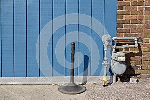 Exterior wall texture background with bright blue painted vertical wood siding