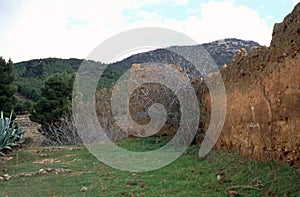 Exterior walls of a kasba built of pressed earth outside Imouzzer Kandar in the Moroccan province of Sefrou. photo