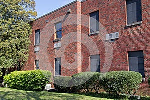 Exterior of windows and brick wall of building