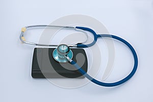 External Computer hard drive and a stethoscope  on a white