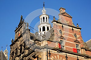 The external facade of Oude Stadhuis Old Town Hall, 16 century with its carvings and turret