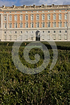 Caserta, Italy. 27/10/2018. The external facade of the palace of Caserta. In the foreground the boxwood plants of the apio garden photo