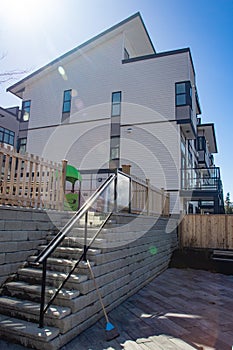 External facade of a row of colorful modern urban townhouses. brand new houses just after construction on real estate market