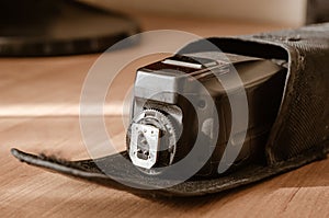 External flash for the camera in a protective case.