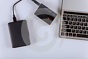 External hard disk and laptop computer transfer photos