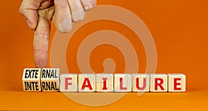 External or internal failure symbol. Concept words External failure or Internal failure on blocks. Beautiful orange background.