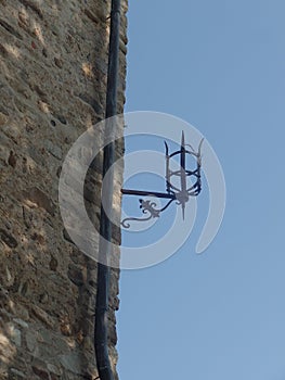 External iron wall torch outside an Italian castle