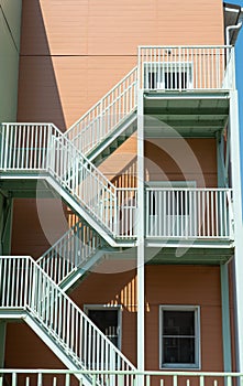 External metal staircase on the facade of the building. Emergency exit.