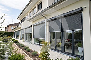 External roller blinds on modern windows