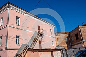 External staircase on the facade of the building. Fire escape in the open air. Emergency ladder