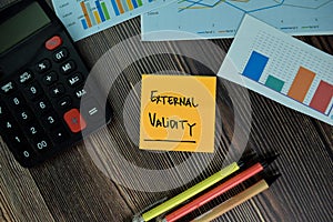 External Validity write on sticky notes isolated on office desk photo