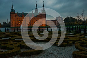 External view of Frederiksborg Castle - palace in Hillerod, Denmark. Renaissance Frederiksborg castle reflected in the lake in