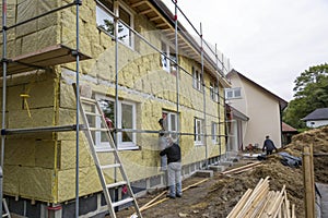 Energy-efficient house wall insulation under construction