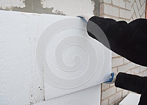 External Wall Insulation: Thermal exterior wall insulation with rigid foam board. Insulating your home saves you money on lower