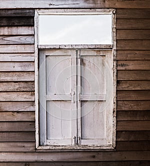 The external wood window and wall of a vintage wood house