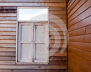 The external wood window and wall of a vintage wood house