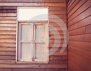 The external wood window and wall of a vintage wood house