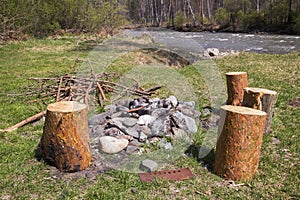 Extinct fire on the river bank