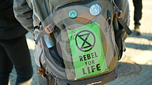 OLOMOUC, CZECH REPUBLIC, FEBRUARY 10, 2019: Extinction rebellion people activists backpack applique rebel for life