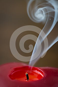 Extinguished candle with smoke