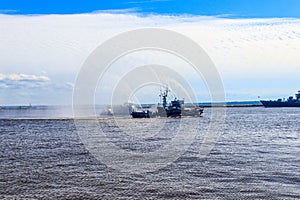 Extinguishing burning ship during naval exercises