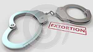 EXTORTION stamp and handcuffs. Crime and punishment related conceptual 3D rendering