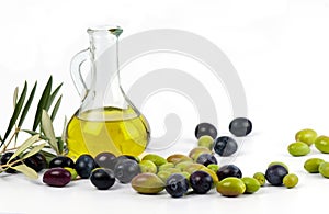 Extra virgin olive oil with fresh olives. photo