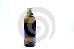 Extra virgin olive oil on plain white background.