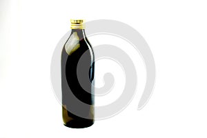 Extra virgin olive oil presented on plain white background.