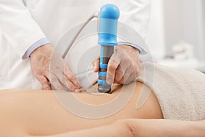 Extracorporeal Shockwave Therapy ESWT.Effective non-surgical treatment.Physical therapy for lower back with shock waves