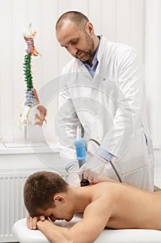 Extracorporeal Shockwave Therapy ESWT.Non-surgical treatment.Physical therapy for neck and back muscles,spine with shock