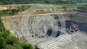 Extraction of granite. Open cast mine. Stone Quarrying.