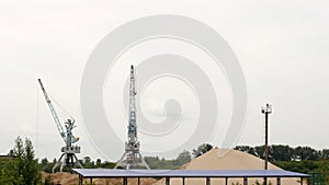 Extraction of river sand by a port crane, production