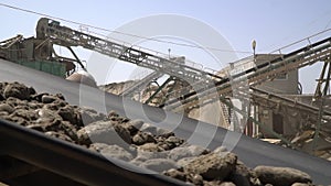 Extractive industry. Conveyor belt with gravel and sand in a quarry