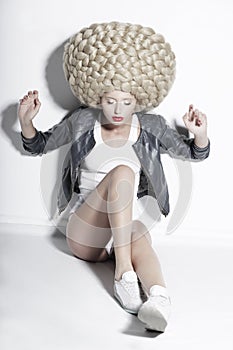 Extravagance. Eccentric Blonde Hair Model with Fantastic Updo Co photo