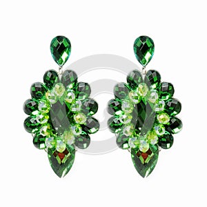 Extravagant big green earrings on a white background