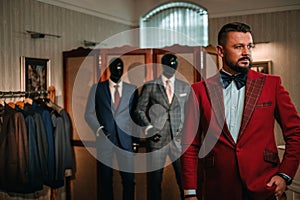 Extravagant stylish man in tailor studio.