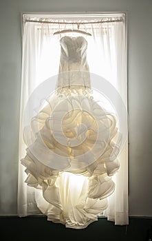 Extravagant wedding dress in window