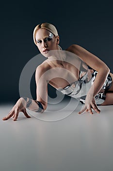 extravagant woman in silver futuristic attire
