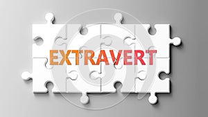 Extravert complex like a puzzle - pictured as word extravert on a puzzle pieces photo