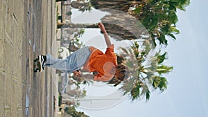 Extremal skater practicing skateboarding on street vertical. Guy perform tricks